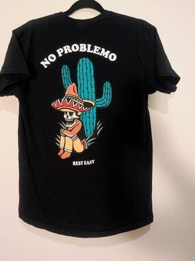 Rest Easy black cotton t-shirt with "No Problemo" graphic
